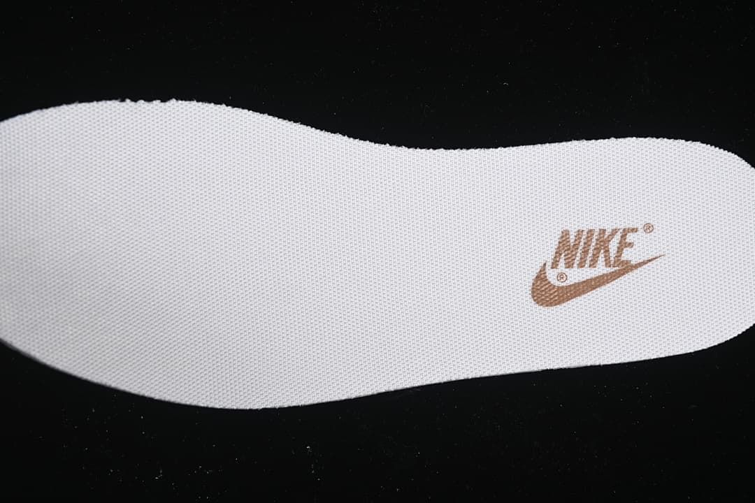 White insole with a brown Nike logo