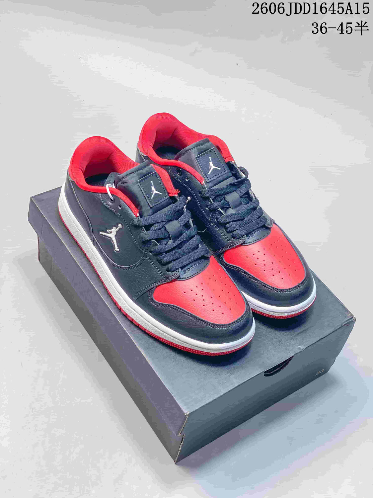 Pair of navy and red Jordan Court Connect low-top sneakers on a shoebox