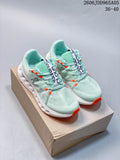 Pair of pale mint On Cloudsurfer Trail shoes with white soles and orange accents