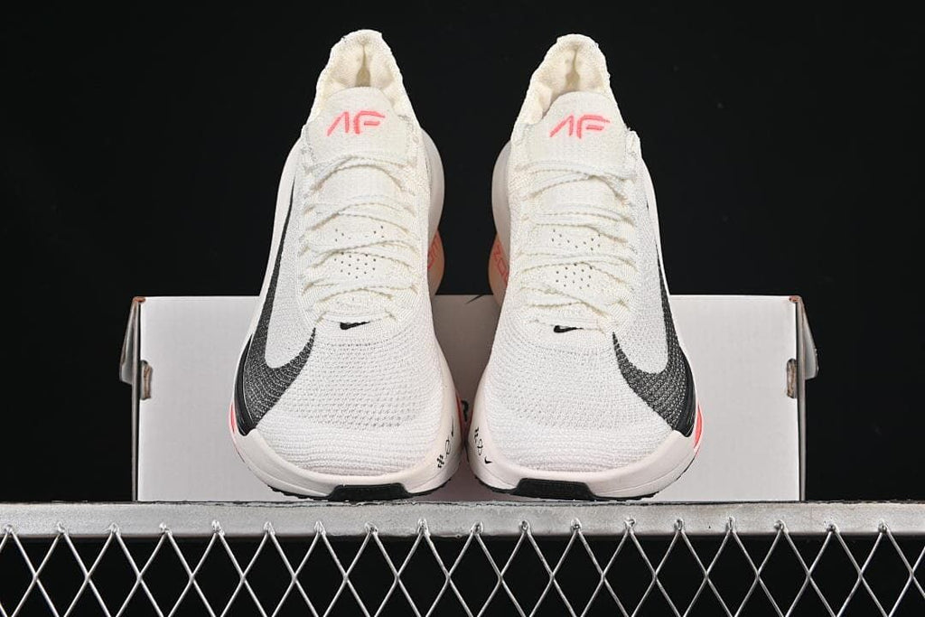 Front view of the pair of shoes on a box