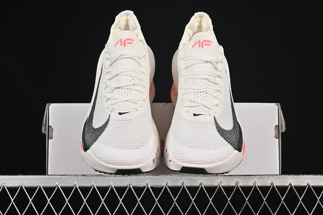 Front view of the pair of shoes on a box