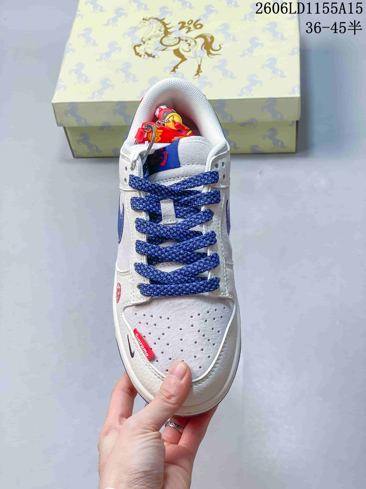 Top view showing blue laces, perforated toe and red accents