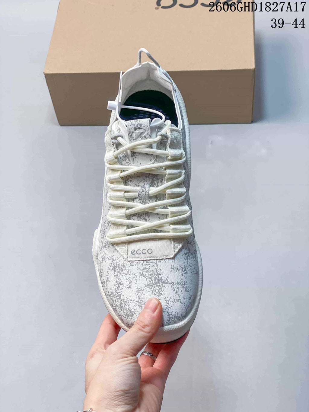 Top view of the sneaker showing its patterned upper and elastic-style lacing.