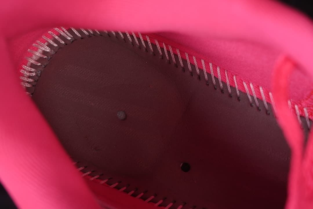 Interior stitching detail inside the pink basketball shoe