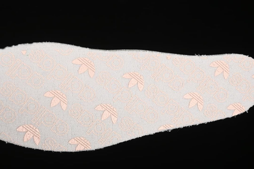 Close-up of patterned insole fabric with pale pink motifs