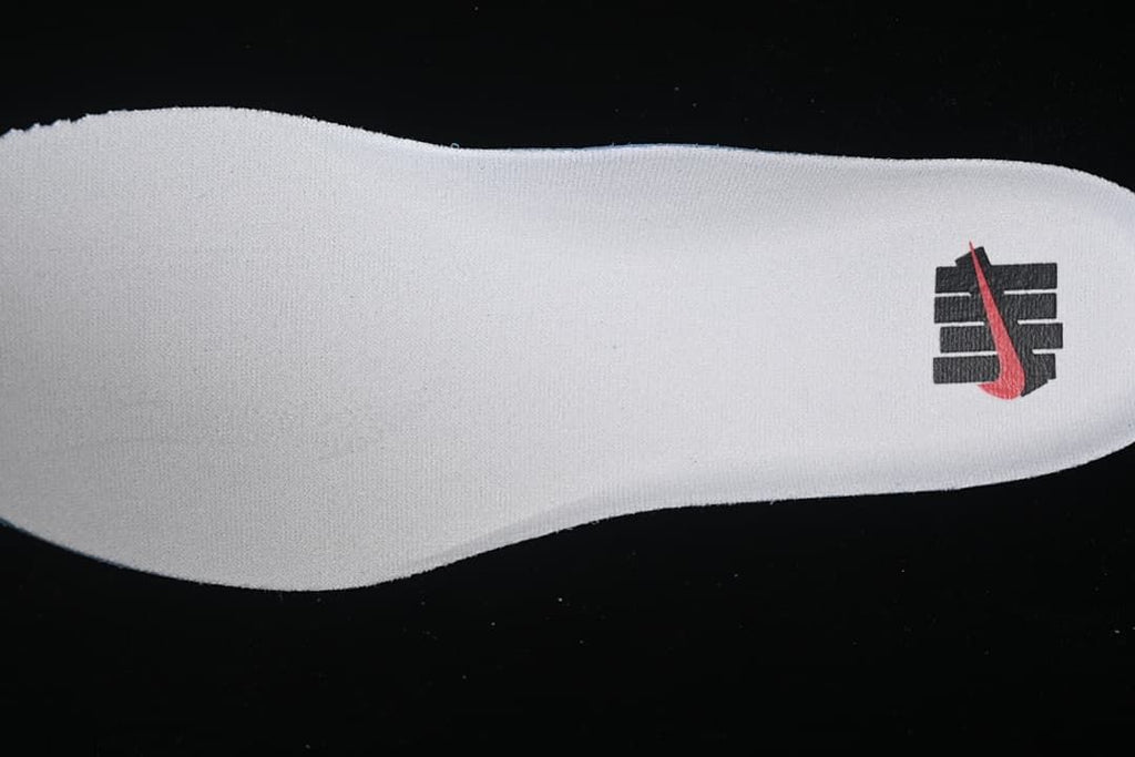 White insole with a black and red graphic.