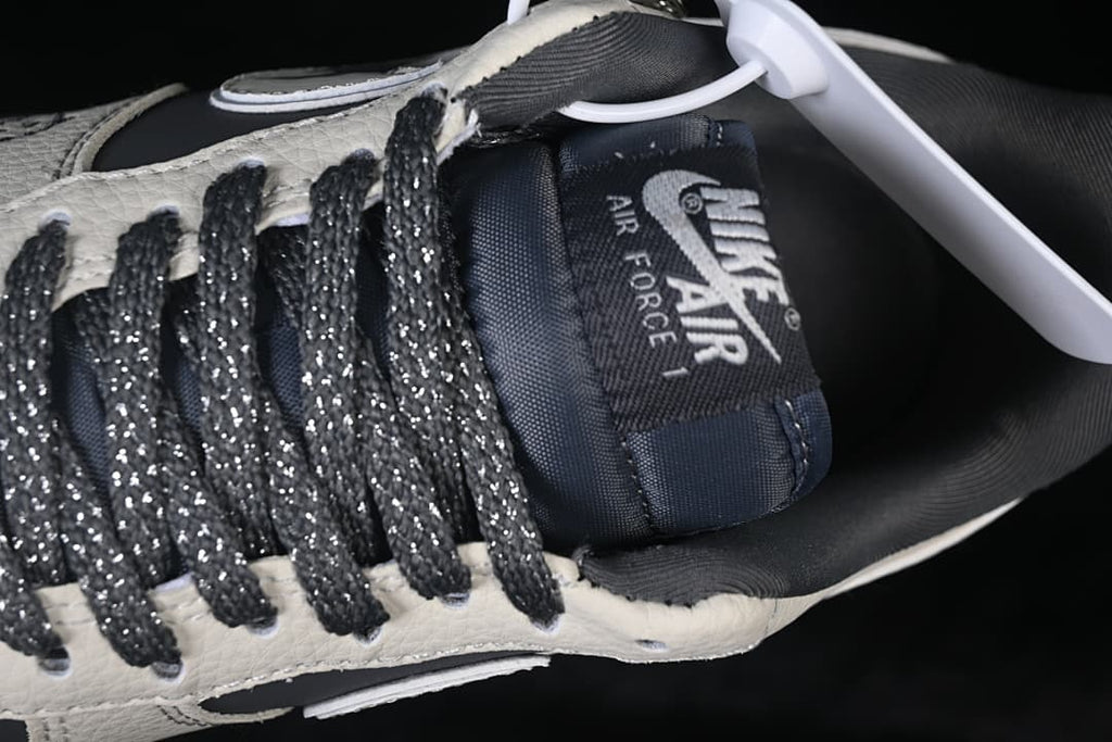 Close-up of the tongue branding and dark laces