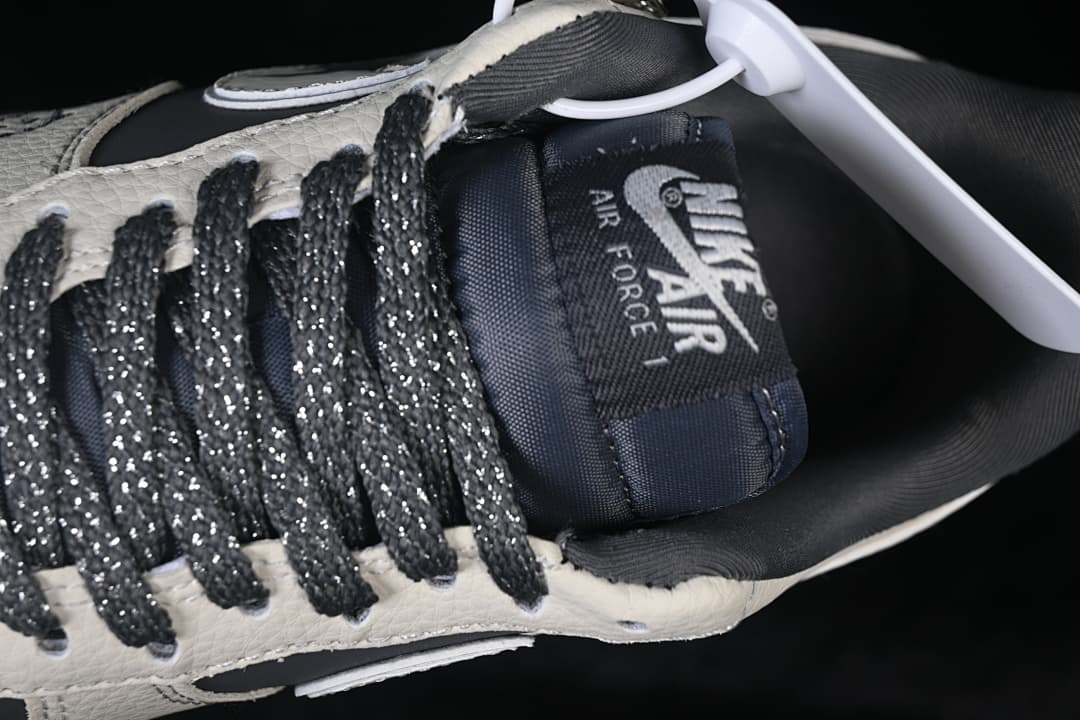Close-up of the tongue branding and dark laces