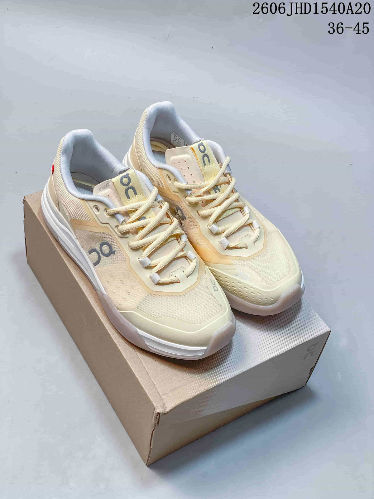 Pair of cream and white On The Roger Adv Pro tennis shoes on a shoebox