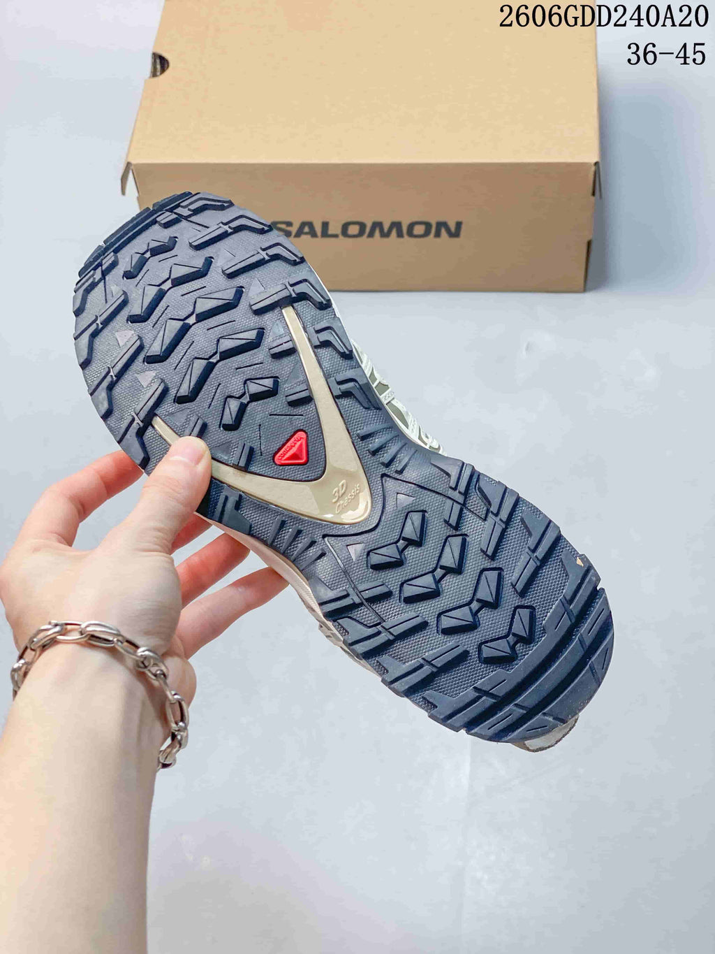Close-up of the shoe outsole showing a dark tread pattern.