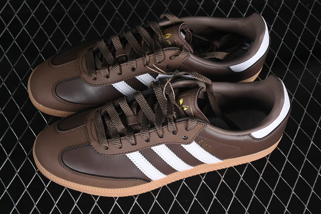 Pair of brown Samba sneakers with white stripes and gum-colored soles
