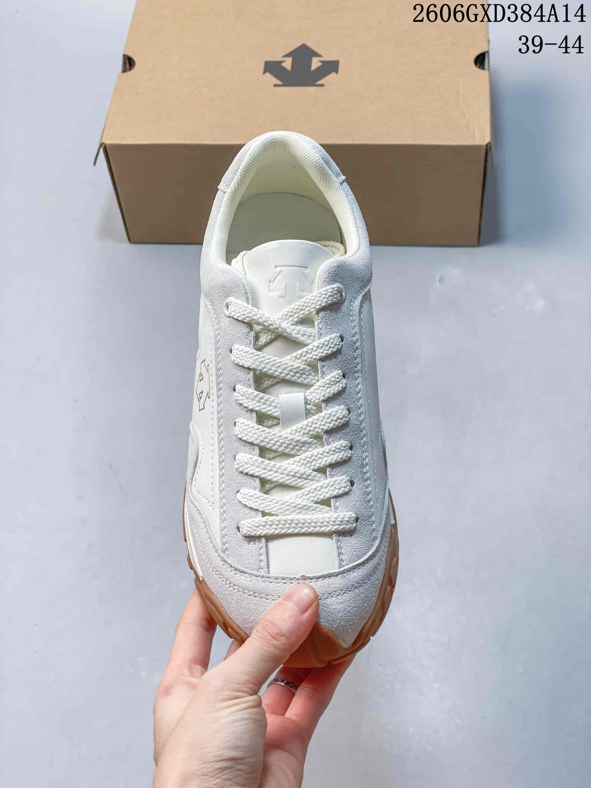 Top view of a white and light gray lace-up sneaker.