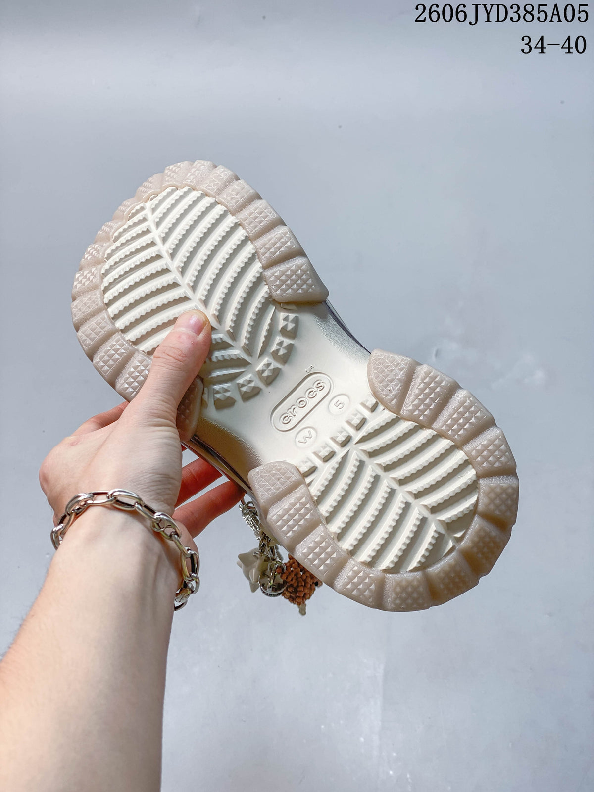 Close-up of the textured outsole on an ivory platform clog