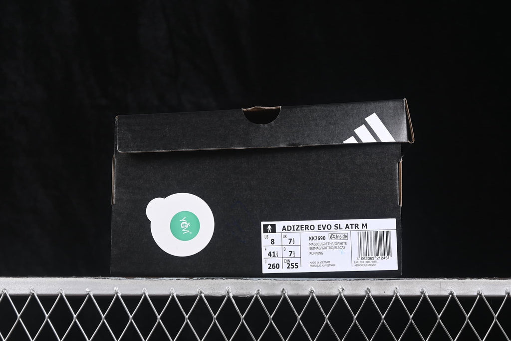 Adidas Adizero Evo SL shoe box showing the model label, KK2690 code, beige and cream color description, and a photographed EU 41 1/3 sample size.