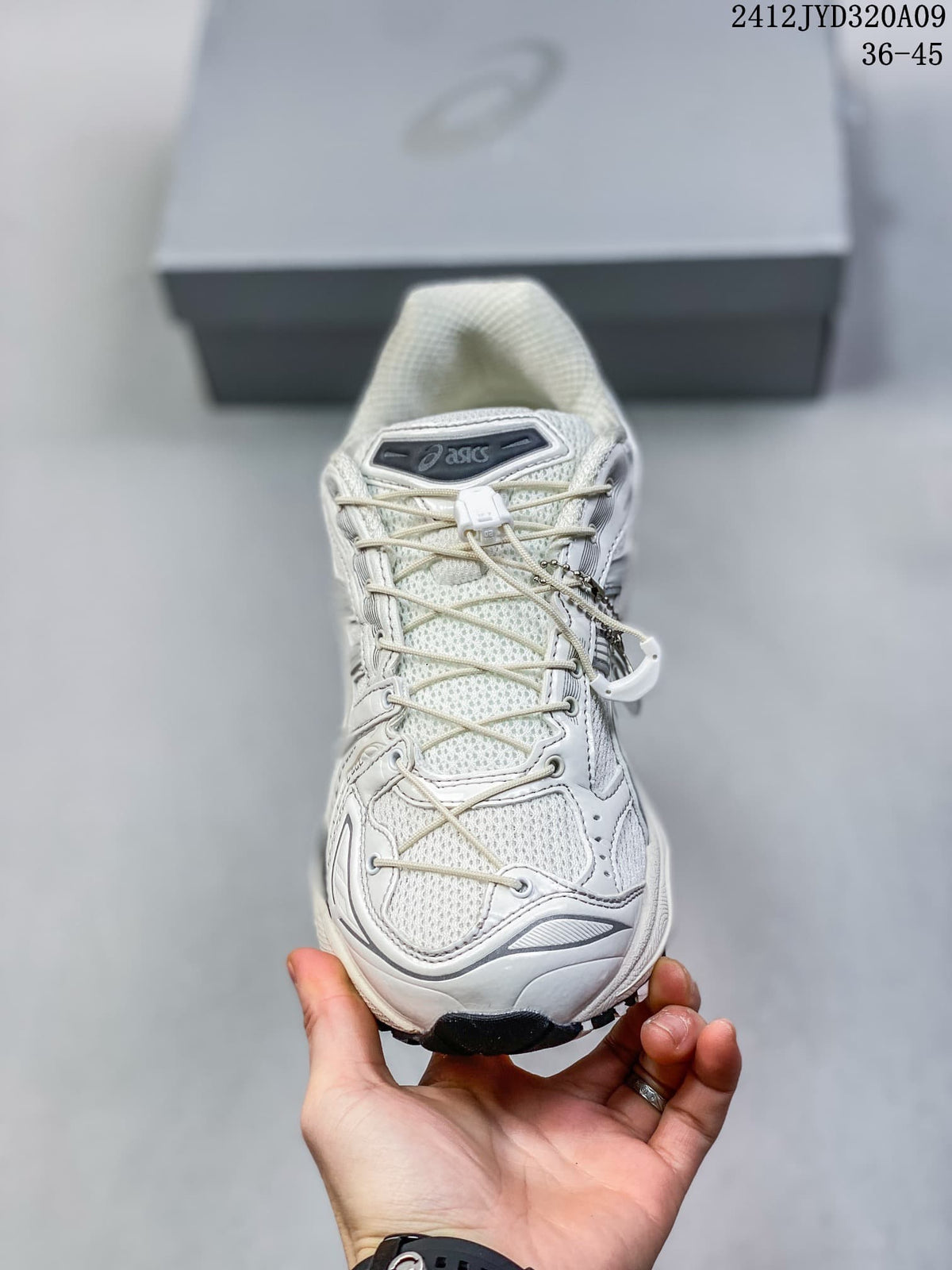 Front view highlighting the mesh toe, laces, and layered upper.