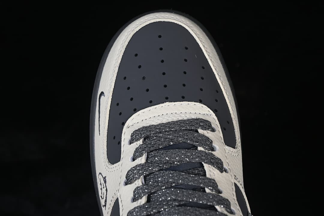 Top view of perforated dark toe and laces