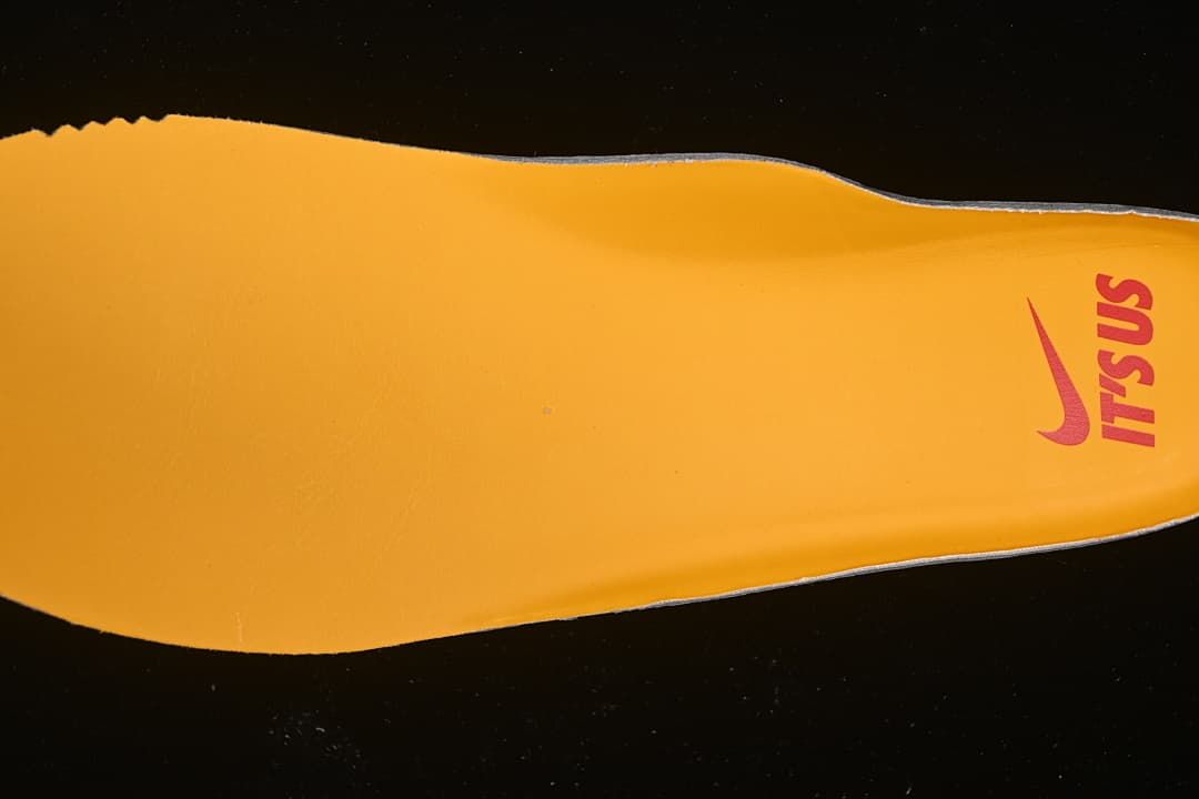 Yellow insole with red branding