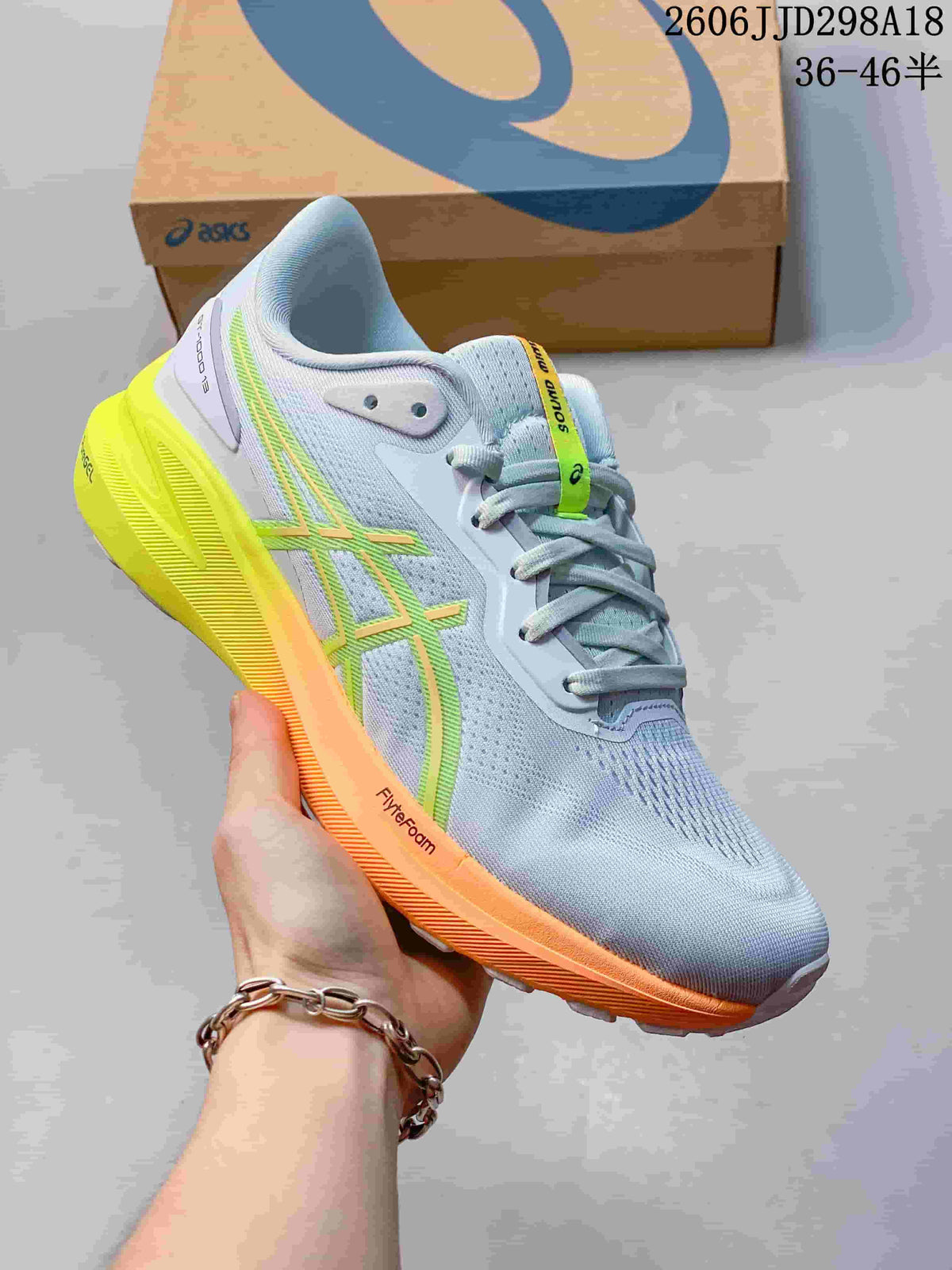 Angled side view of the shoe showing the upper, laces, and colored midsole