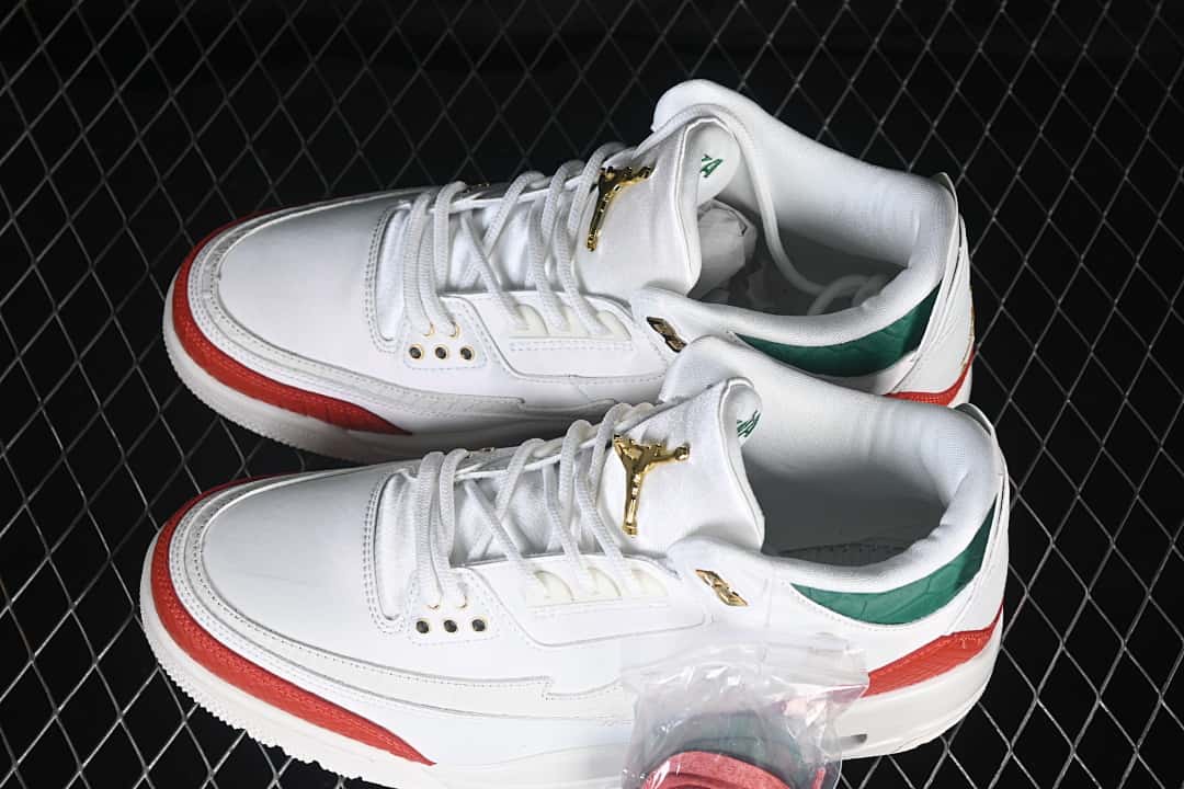 Pair of white, red, and green Jordan sneakers shown from above at an angle