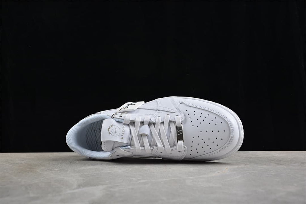 Top-down view of the white sneaker showing laces and perforated toe