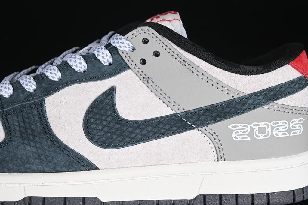 Close-up of the patterned navy Swoosh and decorative heel detail
