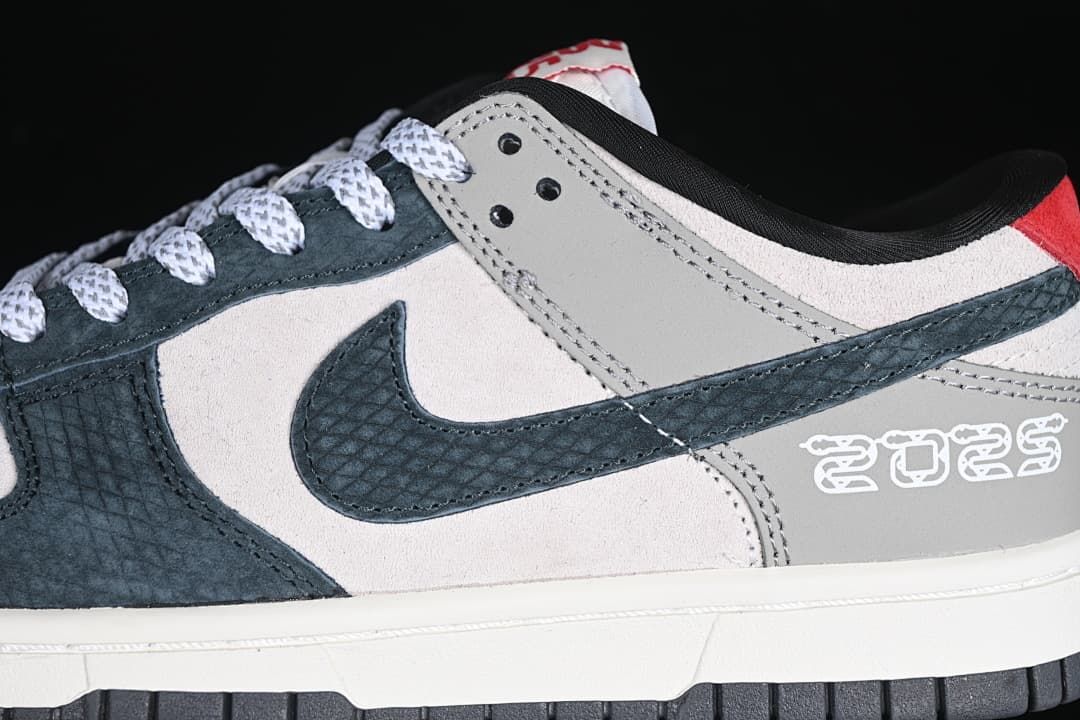 Close-up of the patterned navy Swoosh and decorative heel detail