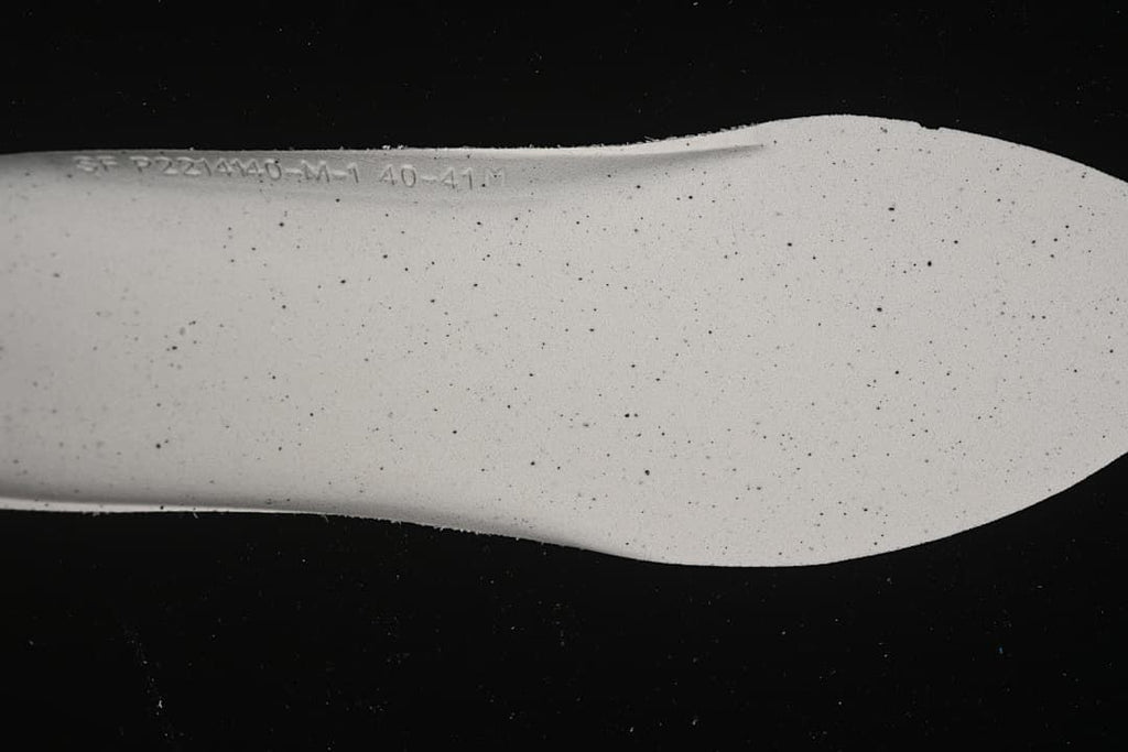 Close-up of the sneaker insole showing a printed marking.