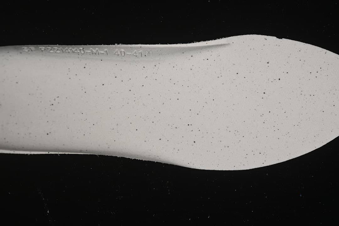 Close-up of the sneaker insole showing a printed marking.