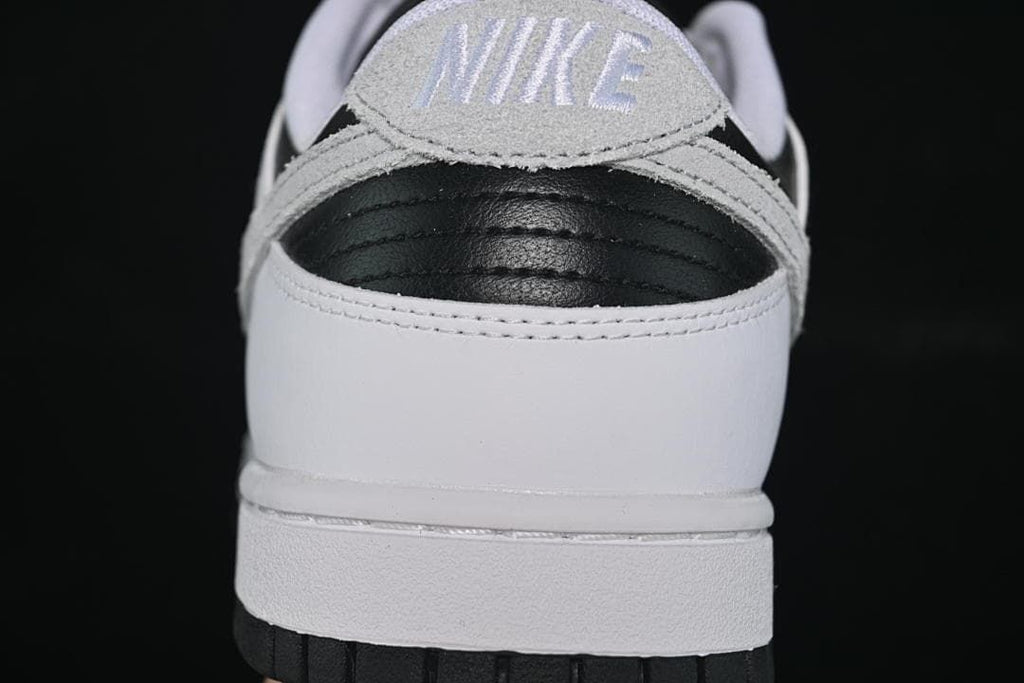 Rear view of the sneaker showing a black heel panel and grey heel tab