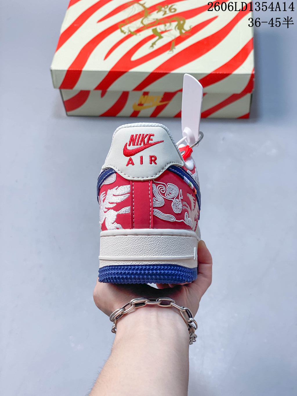 Rear view showing embroidered red heel panels and a white Nike Air heel tab.