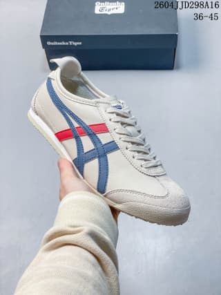 White Mexico 66 sneaker with blue and red side stripes and a matching blue-red heel detail.