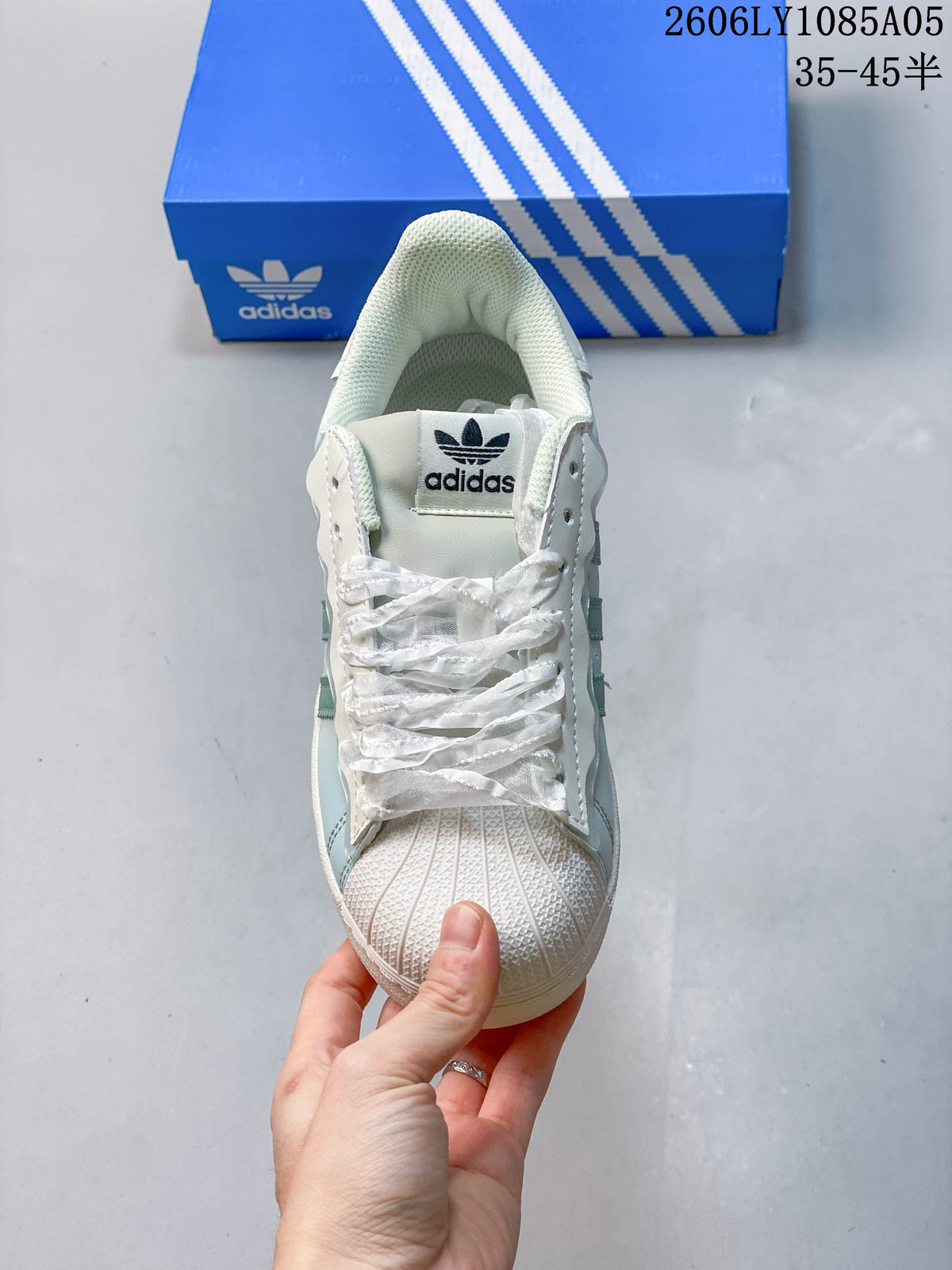 Top view of the lace-up sneaker with its shell toe and trefoil tongue label.