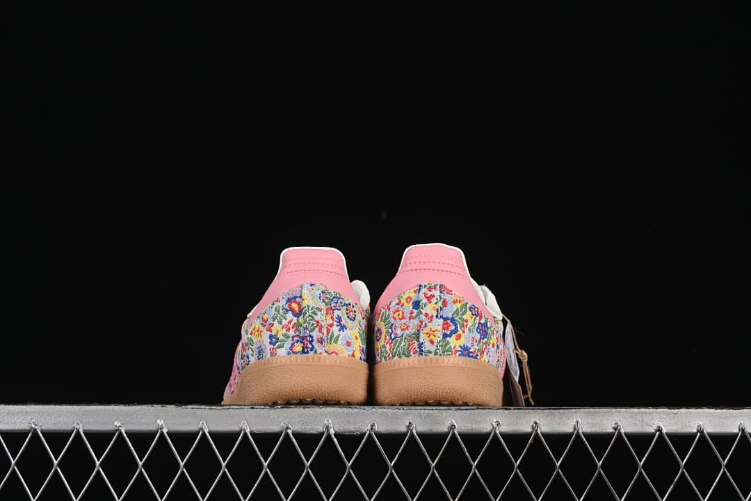 Rear view of the pair showing patterned heel panels and pink heel tabs.