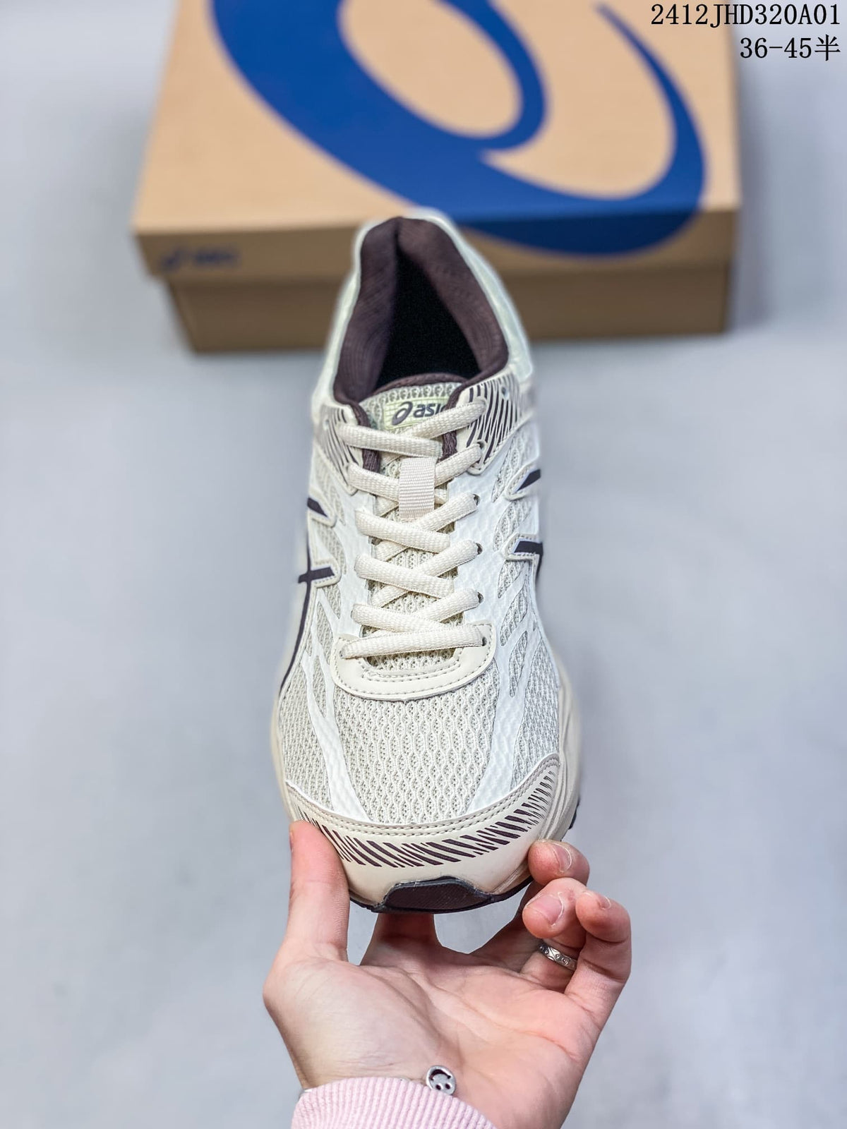 Front view of a cream ASICS GEL-KAHANA 8 shoe with dark accents