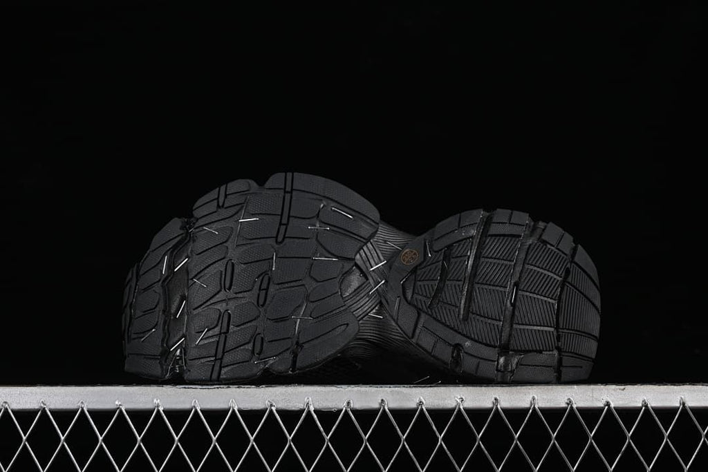 Underside view showing the patterned black outsoles.