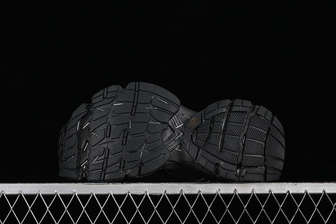 Underside view showing the patterned black outsoles.