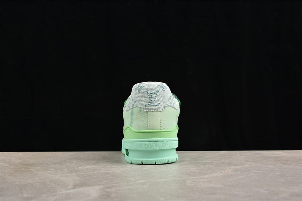 Rear view showing the sneaker heel and layered mint-green sole.