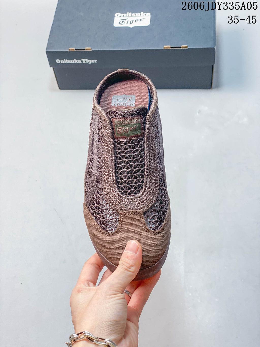 Top view of the brown slip-on shoe with openwork upper panels