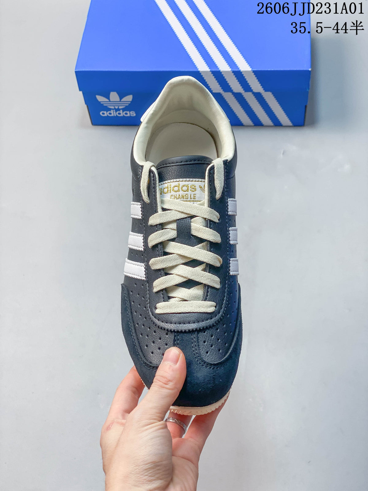 Top view of the sneaker showing cream laces and perforated toe panels