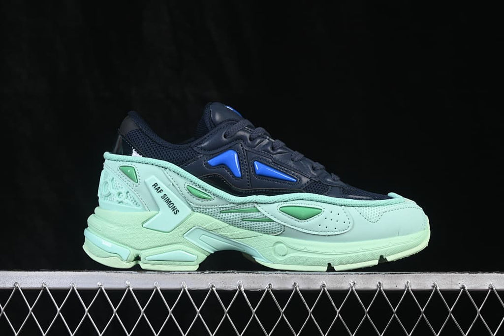 Side profile of a navy and mint Pharaxus sneaker