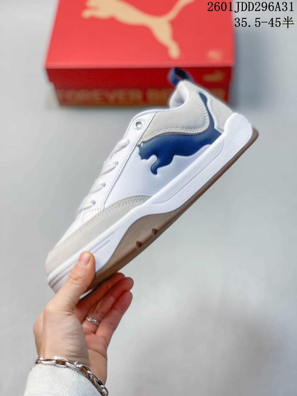 Side view showing the navy PUMA formstrip and chunky sole