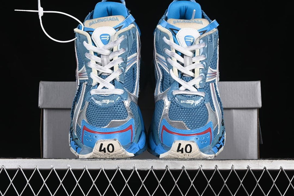Front view of both sneakers showing the toe panels and laces