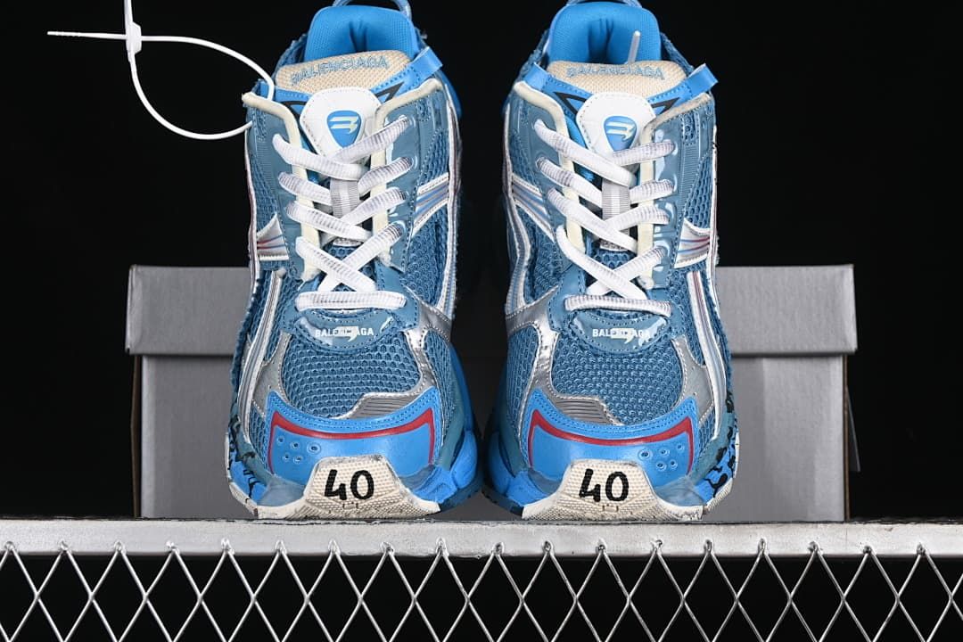 Front view of both sneakers showing the toe panels and laces