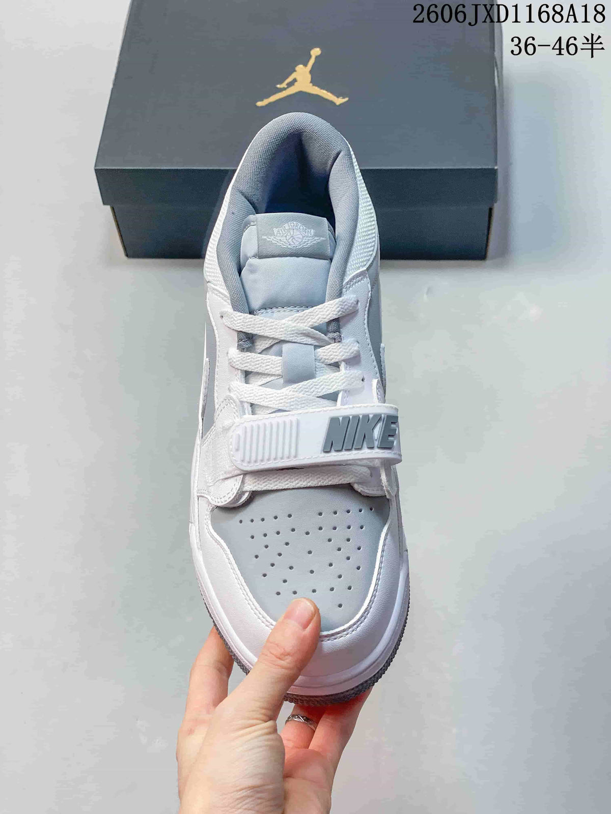 Top view showing the perforated toe and forefoot strap of a Jordan Legacy 312 sneaker
