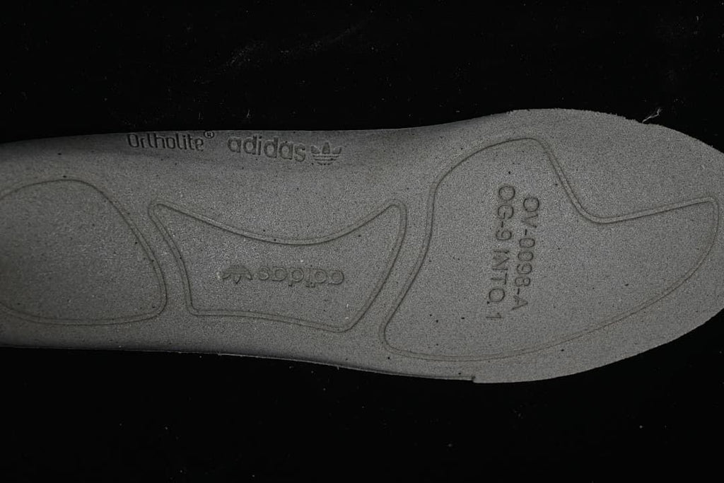 Close-up of the sneaker insole underside with adidas and OrthoLite markings