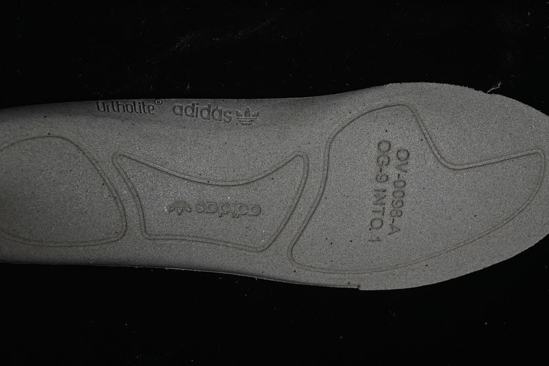 Close-up of the sneaker insole underside with adidas and OrthoLite markings