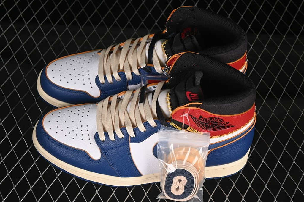 Pair of white, blue, and red high-top sneakers with an extra lace set pictured