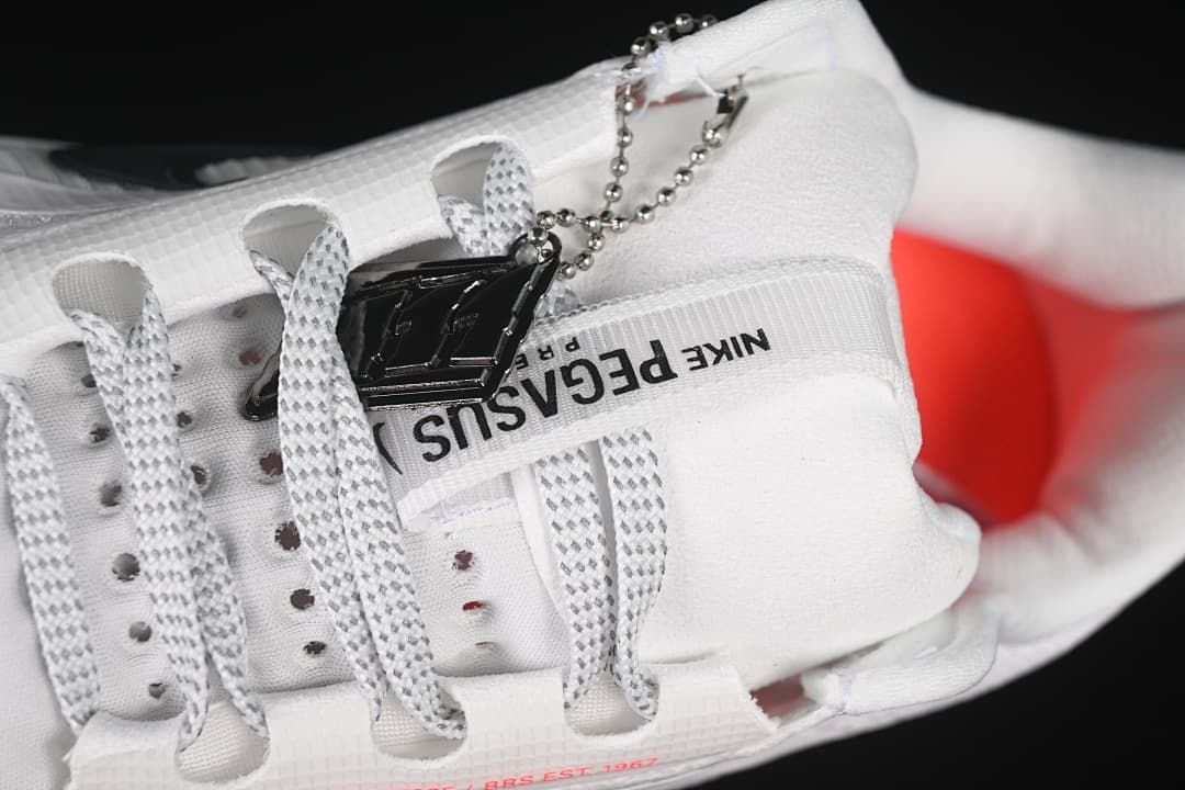 Close-up of the laces, tongue branding, and attached decorative tag.