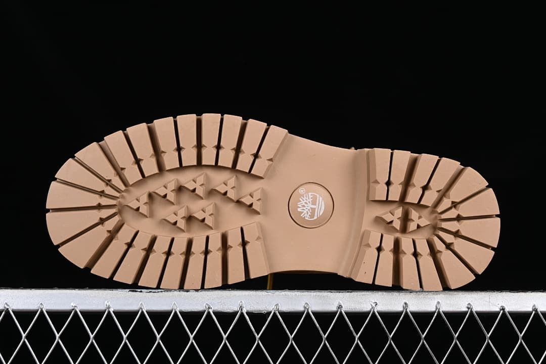Underside view showing the lugged tread pattern