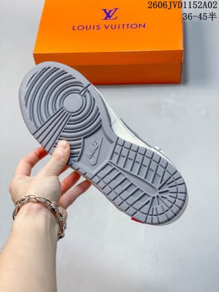 Underside of the sneaker showing a gray rubber outsole with circular and segmented traction patterns.